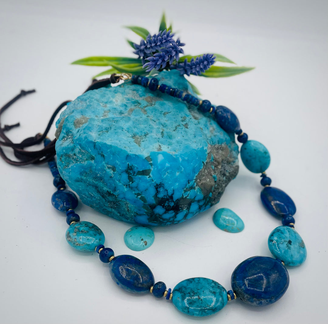 Adjustable beaded hatband featuring lapis nuggets, Kingman turquoise nuggets, African brass details, and finished with deer lace in the back. Available only from Rockstar Cowgirl online or in store in Cody, Wyoming.