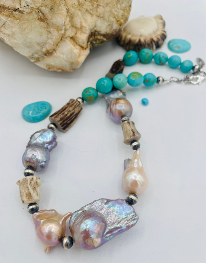 Beaded necklace featuring Flame ball natural luster baroque pearls, deer antler, Kingman turquoise nuggets, and sterling silver beads. Available only from Rockstar Cowgirl online or in store in Cody, Wyoming.