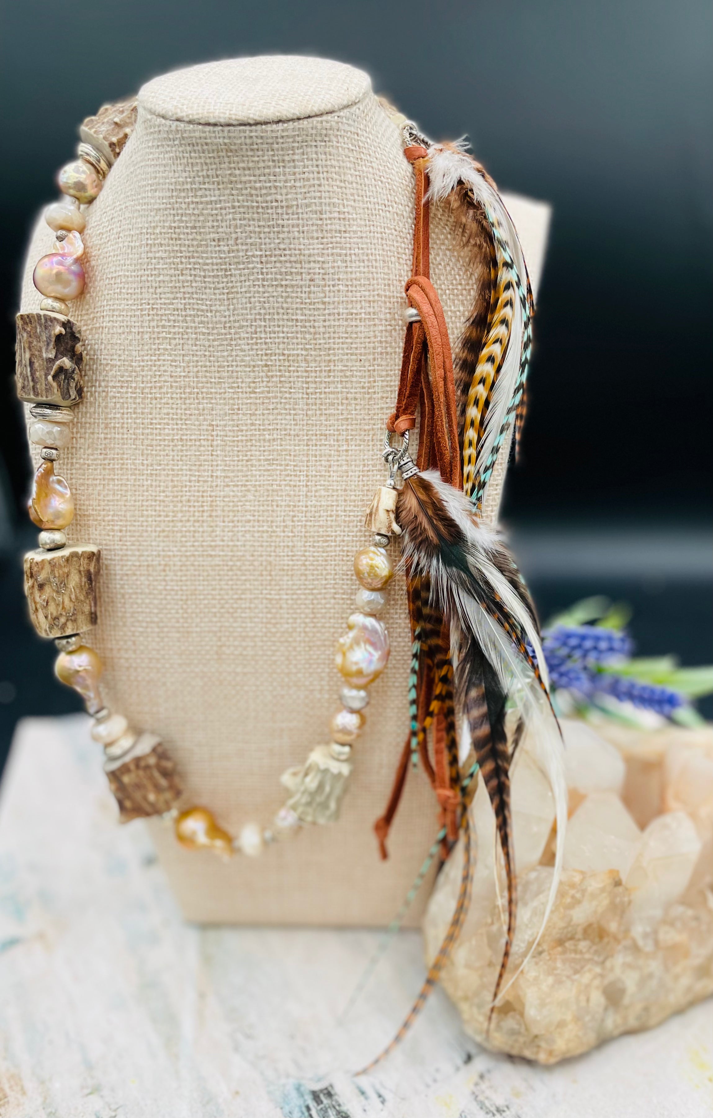 Baroque natural luster pearls, Edison pearls, knobby deer antler beads, moonstone, and sterling silver hatband finished with feathers, deer lace and slide bead. Available only from Rockstar Cowgirl online or in store in Cody, Wyoming.