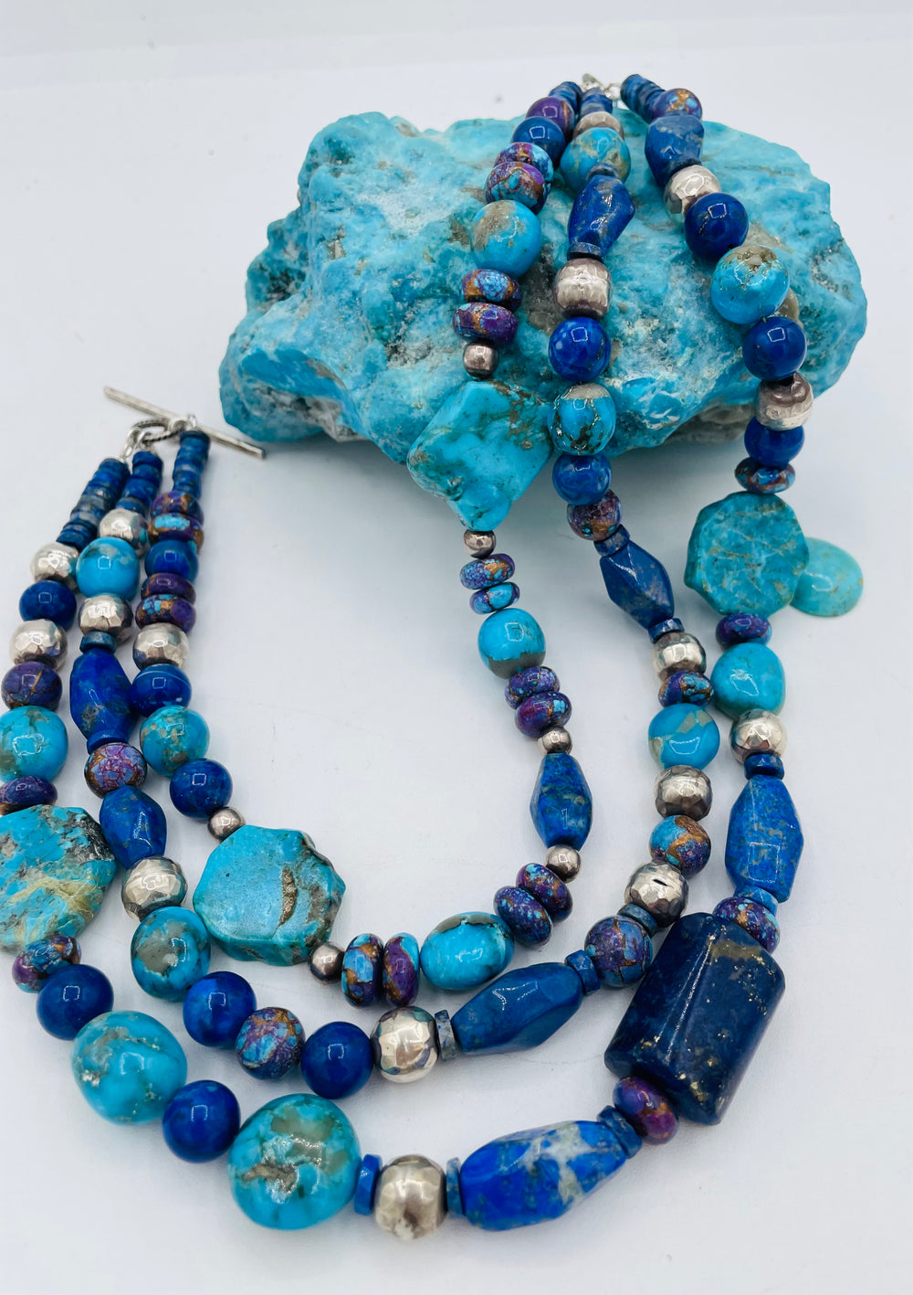 Chunky 3 strand beaded necklace featuring lapis, purple Mojave turquoise, sterling silver beads, Ithaca Peak turquoise, and Kingman turquoise. Available only from Rockstar Cowgirl online or in store in Cody, Wyoming.