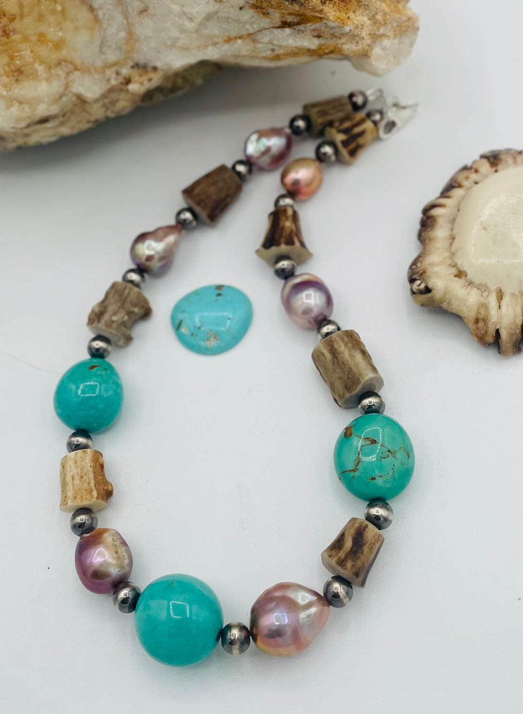 Beaded necklace featuring Kingman turquoise, natural luster pearls, deer antler, and sterling silver beads. Available only from Rockstar Cowgirl online or in store in Cody, Wyoming.