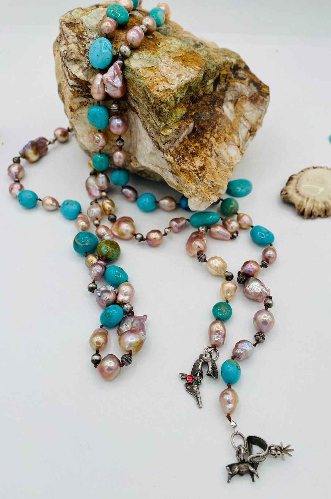 Silk knotted lariat necklace featuring baroque natural luster pearls, Kingman turquoise nuggets, and sterling silver beads. Available only from Rockstar Cowgirl online or in store in Cody, Wyoming.