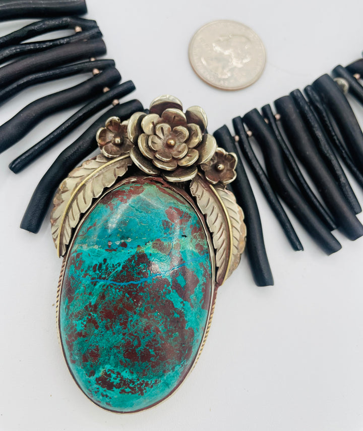 Beaded necklace featuring black coral sticks, smokey Kingman turquoise, sterling silver beads, lava, natural luster pearls, with a chrysocolla and Bali silver pendent. U.S. quarter for size reference. Available only from Rockstar Cowgirl online or in store in Cody, Wyoming.