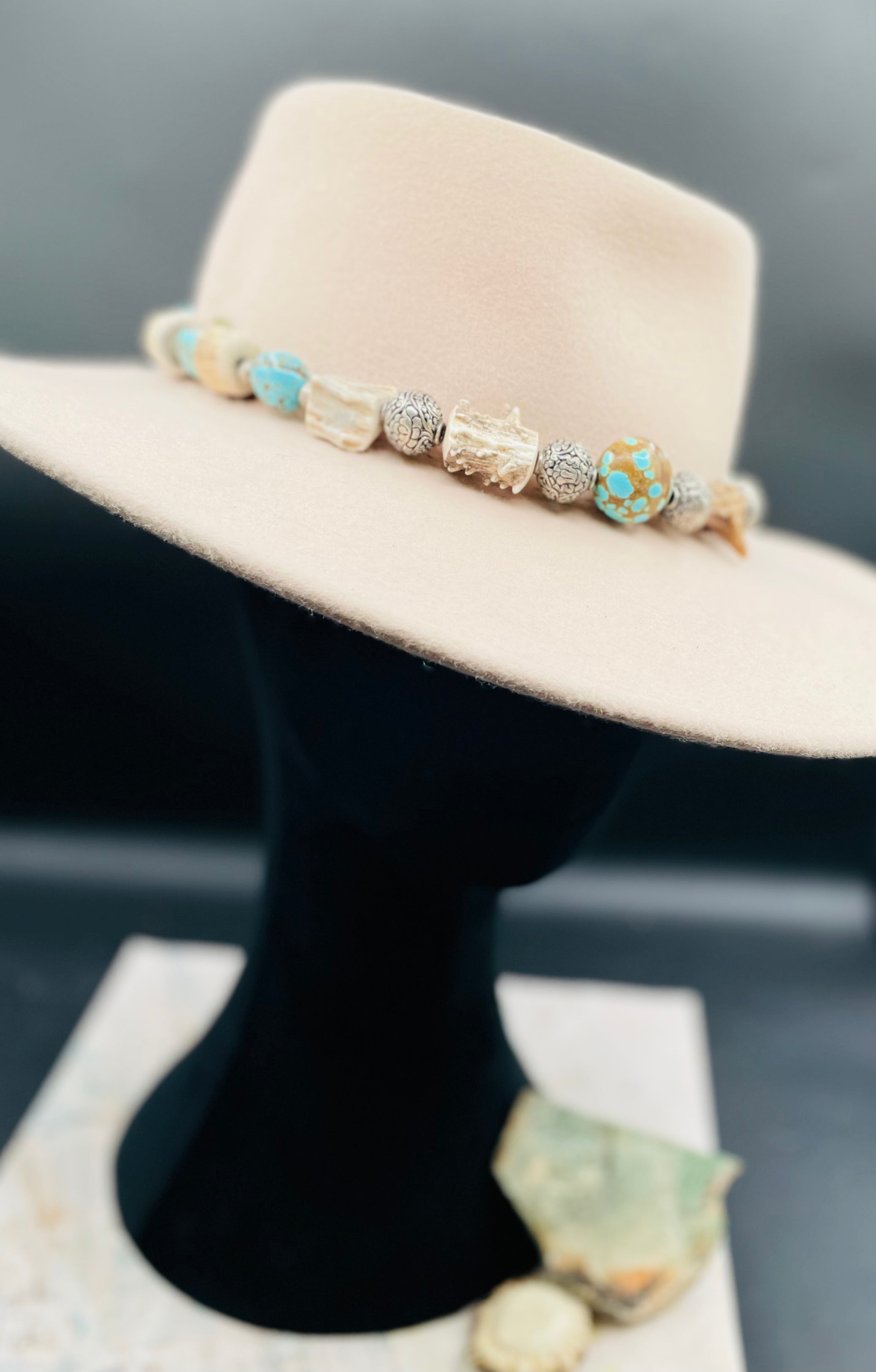 #8 turquoise, knobby deer antler, and sterling silver hatband finished with deer lace and slide bead for fit. Available only from Rockstar Cowgirl online or in store in Cody, Wyoming.