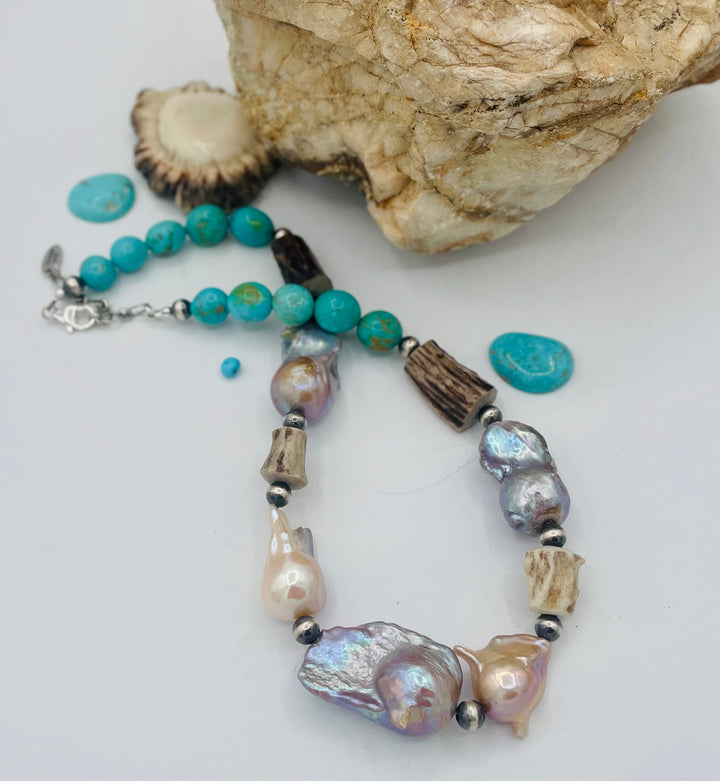 Beaded necklace featuring Flame ball natural luster baroque pearls, deer antler, Kingman turquoise nuggets, and sterling silver beads. Available only from Rockstar Cowgirl online or in store in Cody, Wyoming.