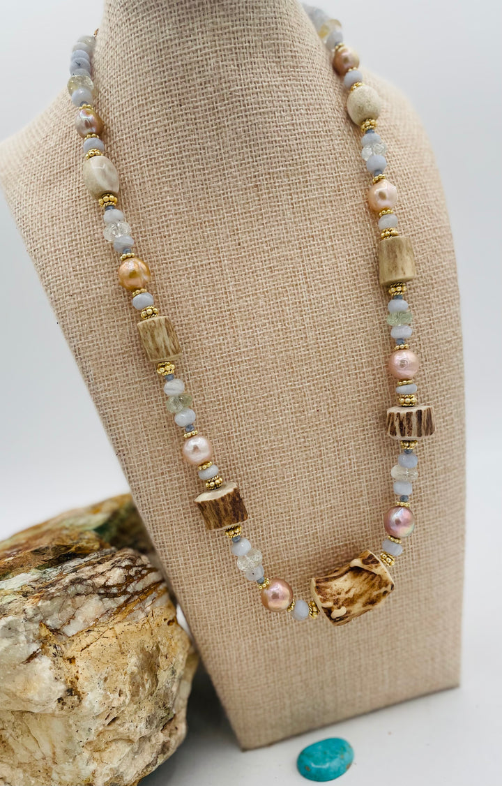 Adjustable beaded hatband featuring blue lace agate, aquamarine, glass crystals, gold details, baroque natural luster pearls, deer antler beads, and finished with deer lace in the back. Available only from Rockstar Cowgirl online or in store in Cody, Wyoming.