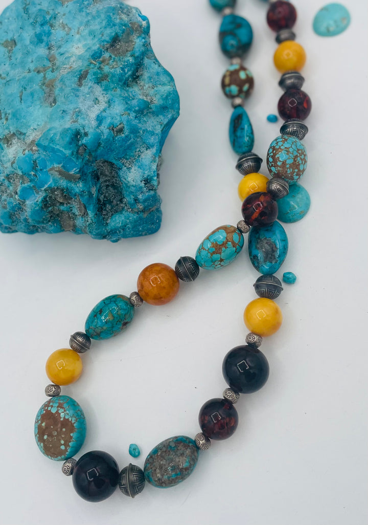 Beaded necklace featuring #8 turquoise, Ithaca Peak turquoise, Kingman turquoise, Baltic amber, and sterling silver beads. Available only from Rockstar Cowgirl online or in store in Cody, Wyoming. 