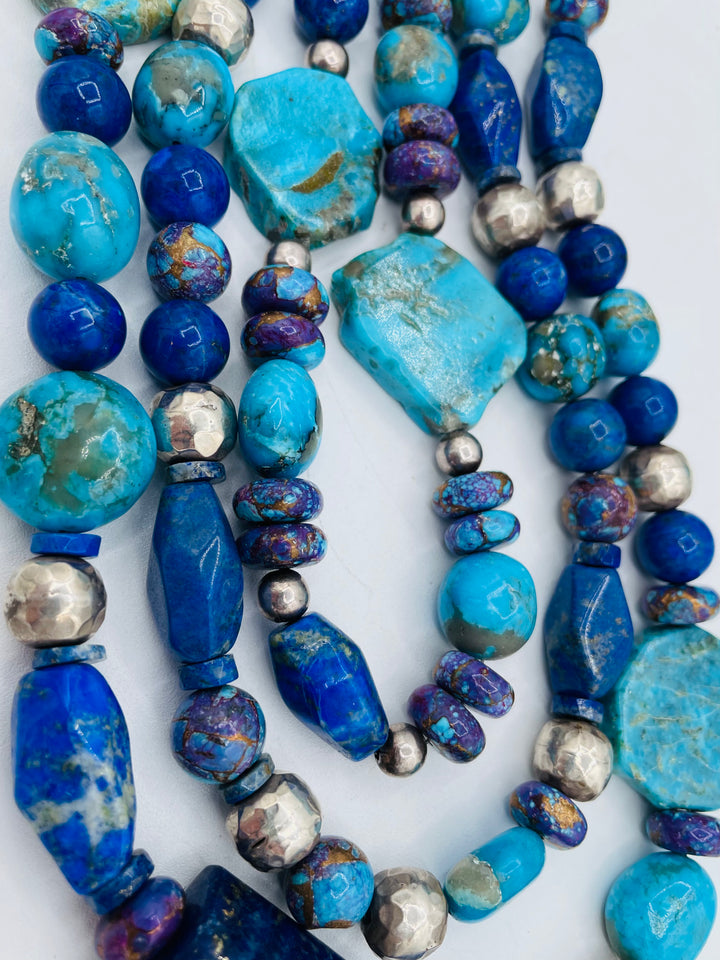 Chunky 3 strand beaded necklace featuring lapis, purple Mojave turquoise, sterling silver beads, Ithaca Peak turquoise, and Kingman turquoise. Available only from Rockstar Cowgirl online or in store in Cody, Wyoming.