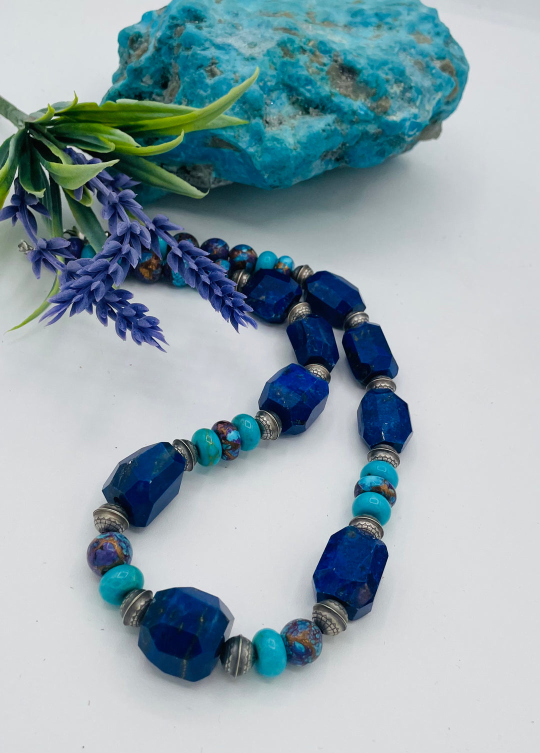 Beaded necklace featuring Lapis lazuli, royal beauty turquoise, purple Mojave turquoise, sterling silver beads and a sterling silver clasp. Available only from Rockstar Cowgirl online or in store in Cody, Wyoming.