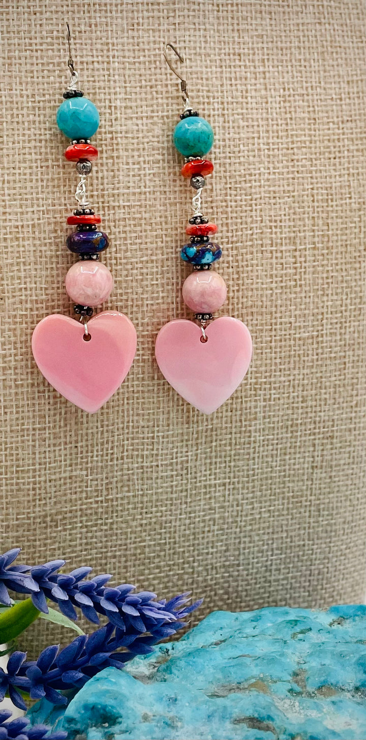 Handmade earrings featuring pink conch shell hearts, rhodochrosite, purple Mojave/ Mohave Kingman turquoise, and spiny oyster beads.  Available only from Rockstar Cowgirl online or in store in Cody, Wyoming.