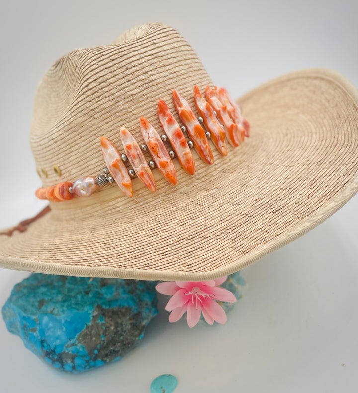 Adjustable beaded hatband featuring spiney oyster, natural luster flameball pearls, sterling silver beads, and finished with deer lace in the back. Available only from Rockstar Cowgirl online or in store in Cody, Wyoming.