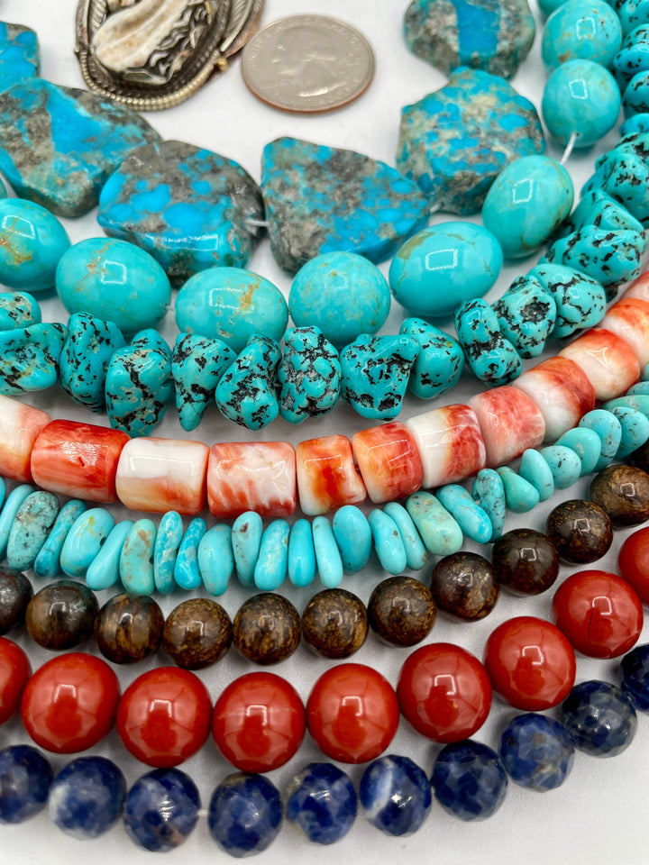 Bead box featuring Kingman turquoise, Sonoran turquoise, sodalite, spiney oyster, red jasper, bronzite, and a bone horse pendent. U.S. quarter for size reference. Available only from Rockstar Cowgirl online or in store in Cody, Wyoming