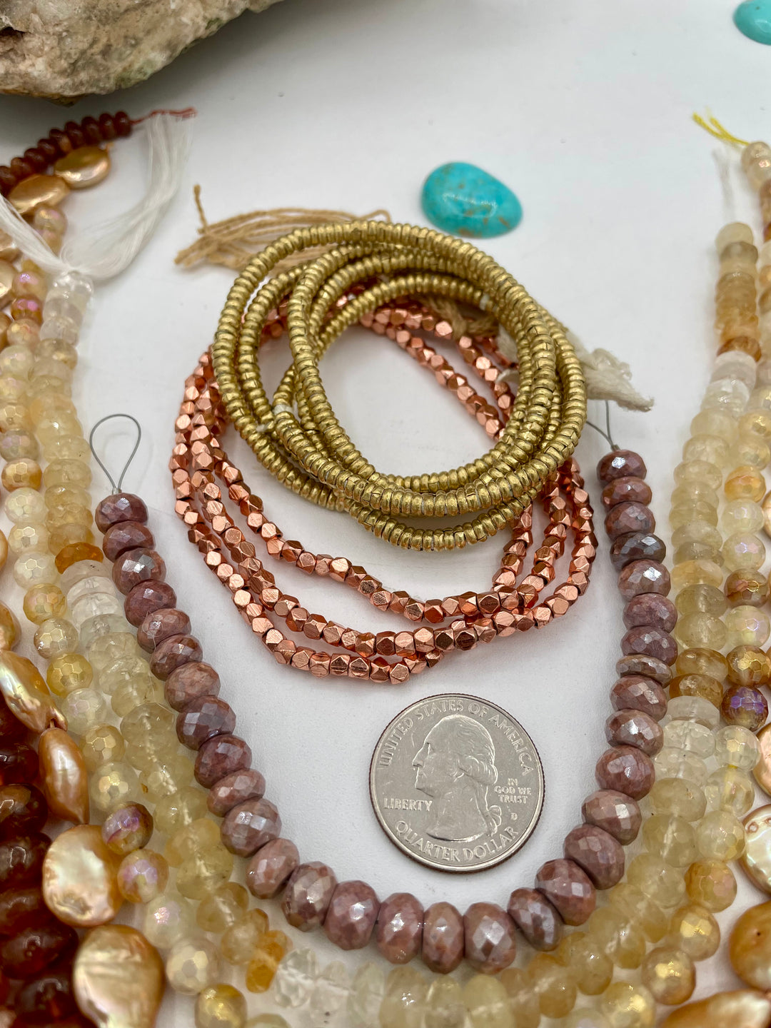The Sun and Moon bead box features strands of Edison pearls, plated agate, brown moonstone, sunstone, hessonite garnet, coin pearls, citrine, brown silverite, with copper and brass spacer beads. Available only from Rockstar Cowgirl online or in store in Cody, Wyoming.