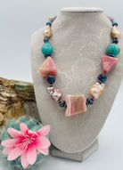 Chunky necklace featuring giant pink Peruvian opal nuggets, AAA grade natural luster baroque pearls, purple Mojave turquoise, and sterling silver Navajo pearl beads. Available only from Rockstar Cowgirl online or in store in Cody, Wyoming.