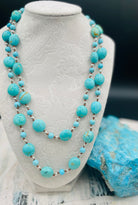 Long silk knotted necklace featuring Kingman turquoise nuggets and rounds with gold matrix, and hammered sterling silver beads. Available only from Rockstar Cowgirl online or in store in Cody, Wyoming.