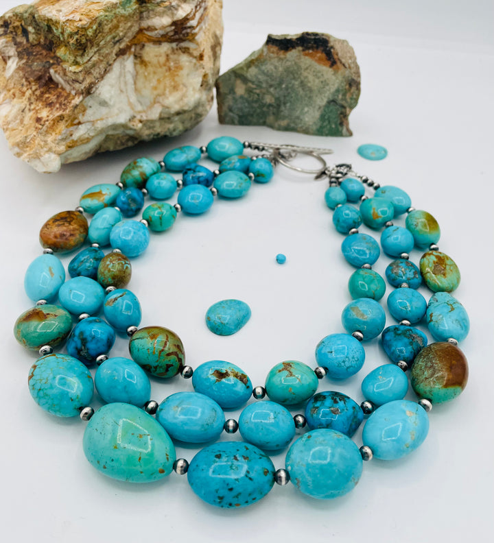 3 strand beaded necklace featuring Kingman turquoise in blues and greens with sterling silver Navajo pearl beads. Available only from Rockstar Cowgirl online or in store in Cody, Wyoming.