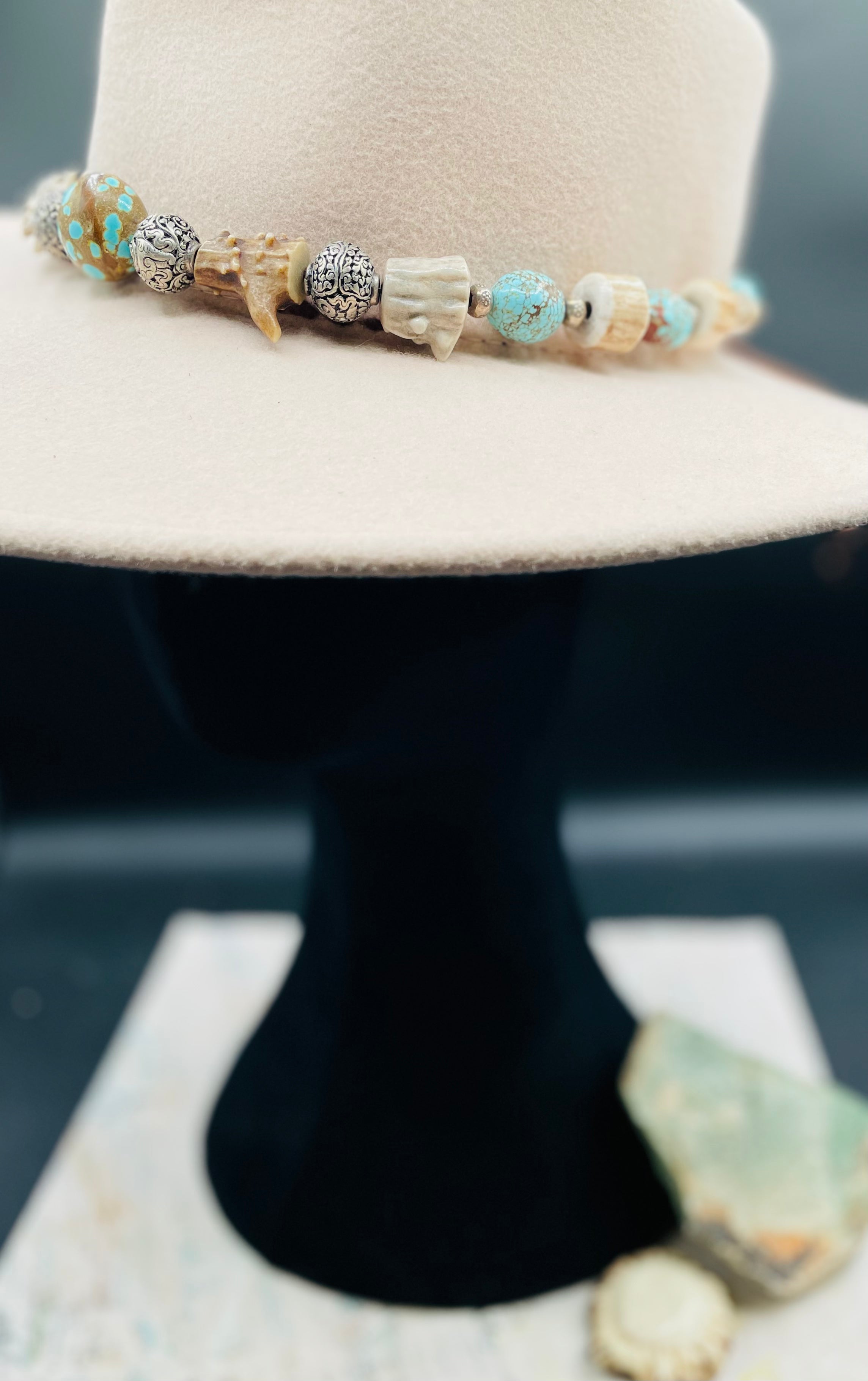 #8 turquoise, knobby deer antler, and sterling silver hatband finished with deer lace and slide bead for fit. Available only from Rockstar Cowgirl online or in store in Cody, Wyoming.