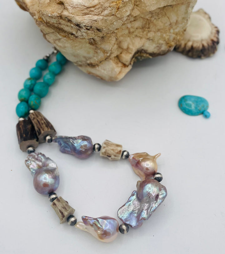 Beaded necklace featuring Flame ball natural luster baroque pearls, deer antler, Kingman turquoise nuggets, and sterling silver beads. Available only from Rockstar Cowgirl online or in store in Cody, Wyoming.
