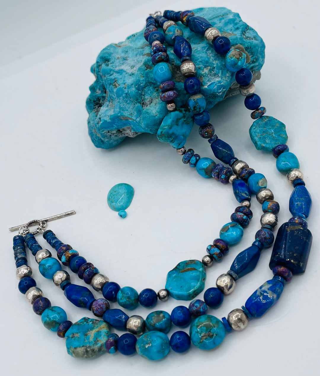 Chunky 3 strand beaded necklace featuring lapis, purple Mojave turquoise, sterling silver beads, Ithaca Peak turquoise, and Kingman turquoise. Available only from Rockstar Cowgirl online or in store in Cody, Wyoming.