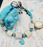 Beaded hatband with giant elk antler beads, Campitos turquoise, lapis, sterling silver, and Bali silver beads finished with leather lace and slide bead for fit. Available only from Rockstar Cowgirl online or in store in Cody, Wyoming.