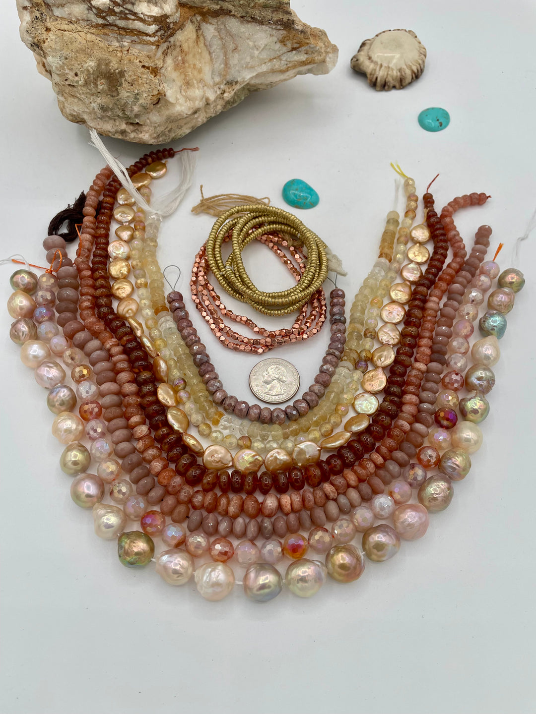 The Sun and Moon bead box features strands of Edison pearls, plated agate, brown moonstone, sunstone, hessonite garnet, coin pearls, citrine, brown silverite, with copper and brass spacer beads. Available only from Rockstar Cowgirl online or in store in Cody, Wyoming.