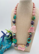 Chunky necklace featuring pink Peruvian opal nuggets, Kingman turquoise, cape amethyst, amazonite, and sterling silver Navajo pearl beads. Available only from Rockstar Cowgirl online or in store in Cody, Wyoming.