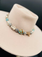 #8 turquoise, knobby deer antler, and sterling silver hatband finished with deer lace and slide bead for fit. Available only from Rockstar Cowgirl online or in store in Cody, Wyoming.