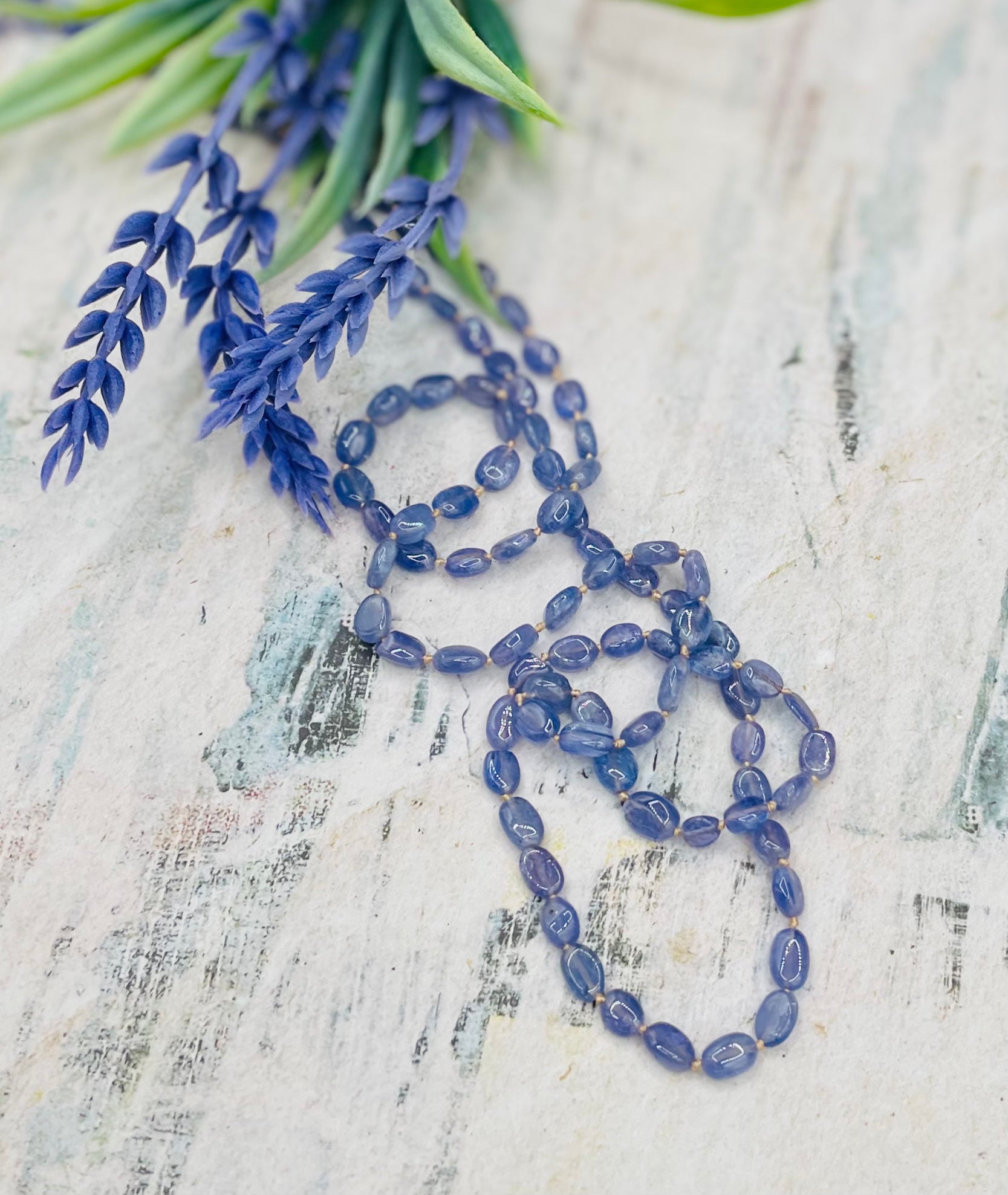 Silk knotted Tanzanite long necklace with gold silk and 14k lobster clasp. Available only from Rockstar Cowgirl online or in store in Cody, Wyoming.