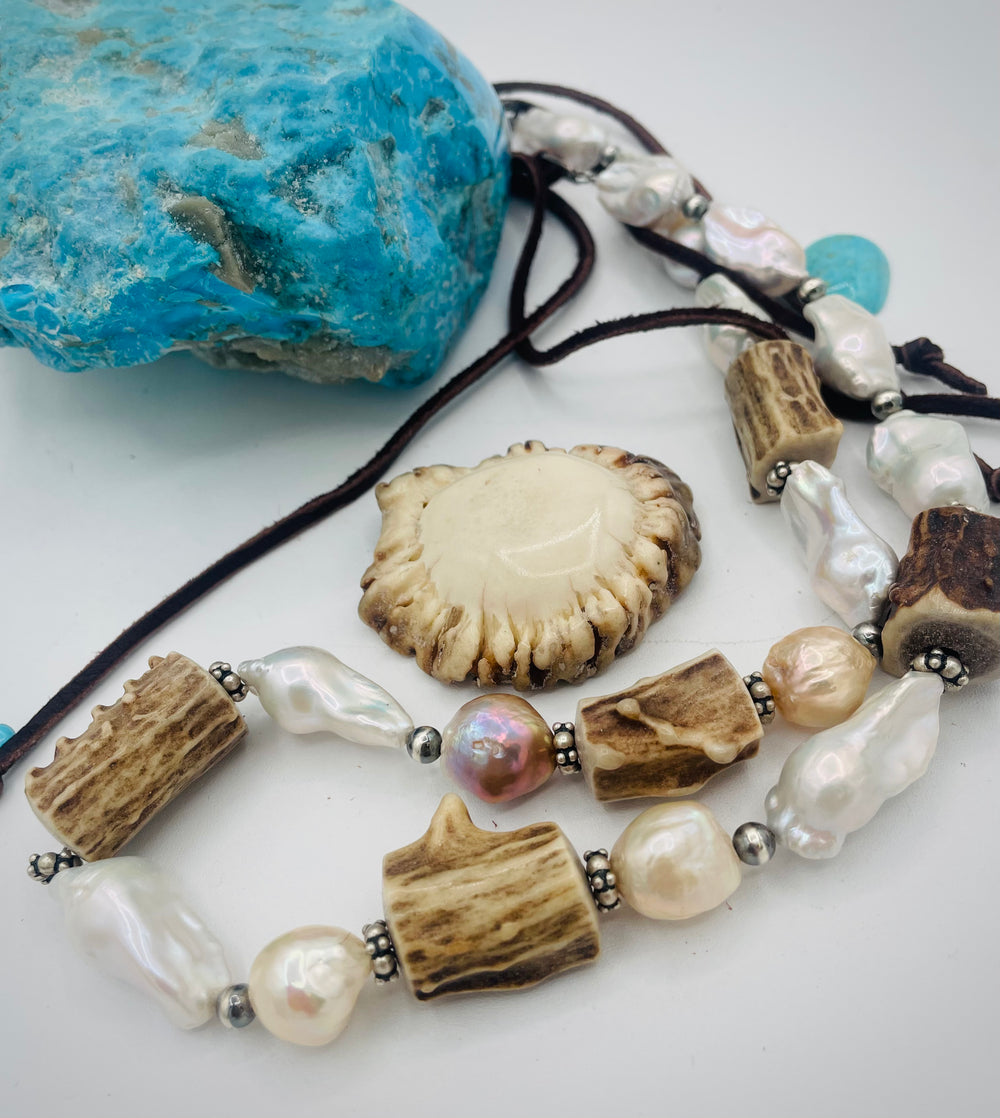 Adjustable beaded hattband featuring white flameball baroque pearls, textured deer antler, sterling silver beads, and finished with deer lace in the back. Available only from Rockstar Cowgirl online or in store in Cody, Wyoming.