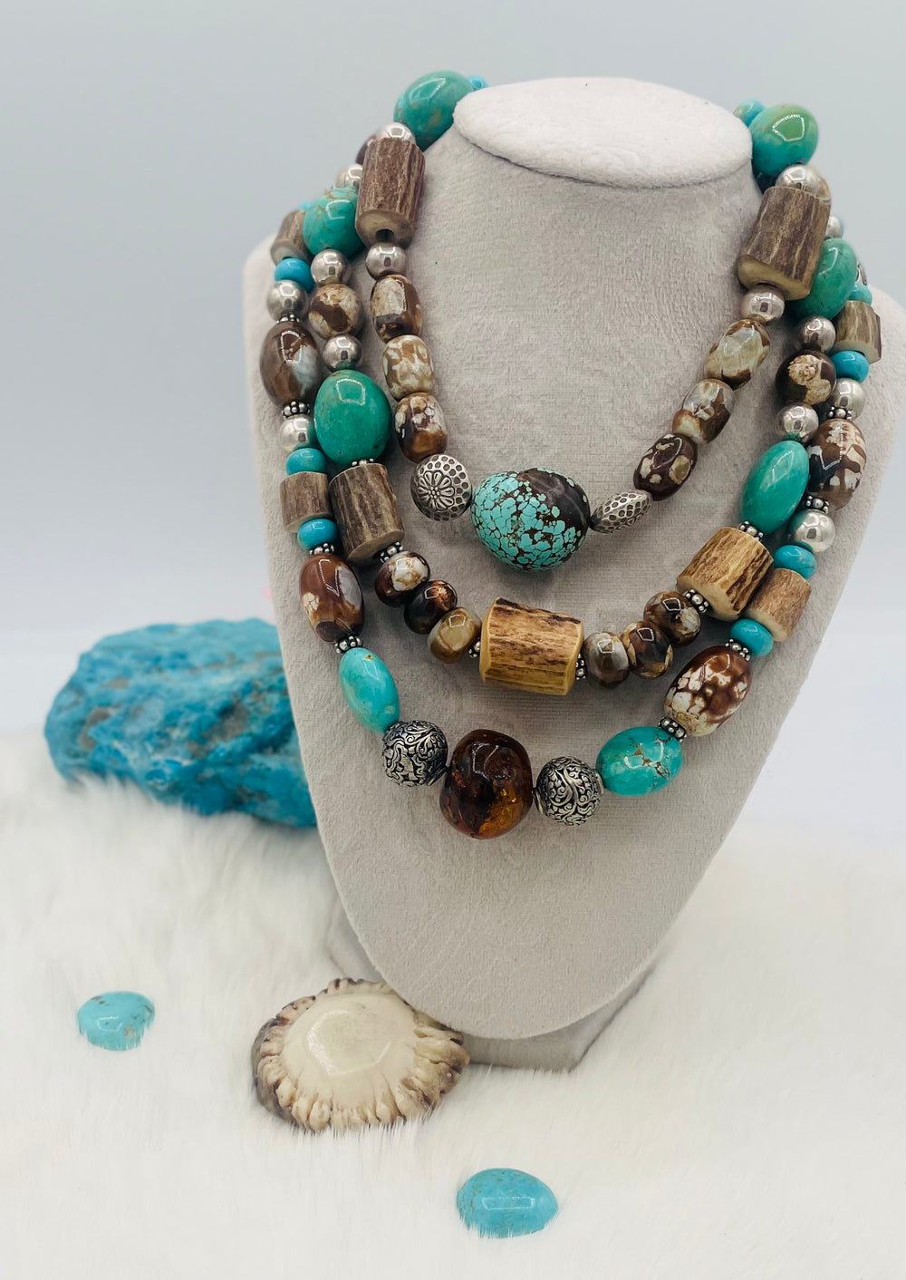 Beaded 3 strand necklace featuring #8 turquoise nuggets, Kingman turquoise nuggets, royal beauty turquoise, crazy lace agate, textured deer antler, and sterling silver beads. Available only from Rockstar Cowgirl online or in store in Cody, Wyoming.
