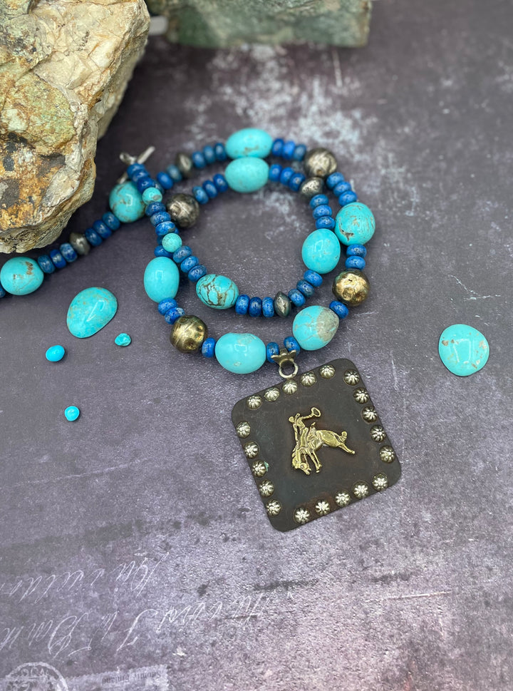 Kingman turquoise and lapis necklace with a large concho pendent. Available only from Rockstar Cowgirl online or in store in Cody, Wyoming.