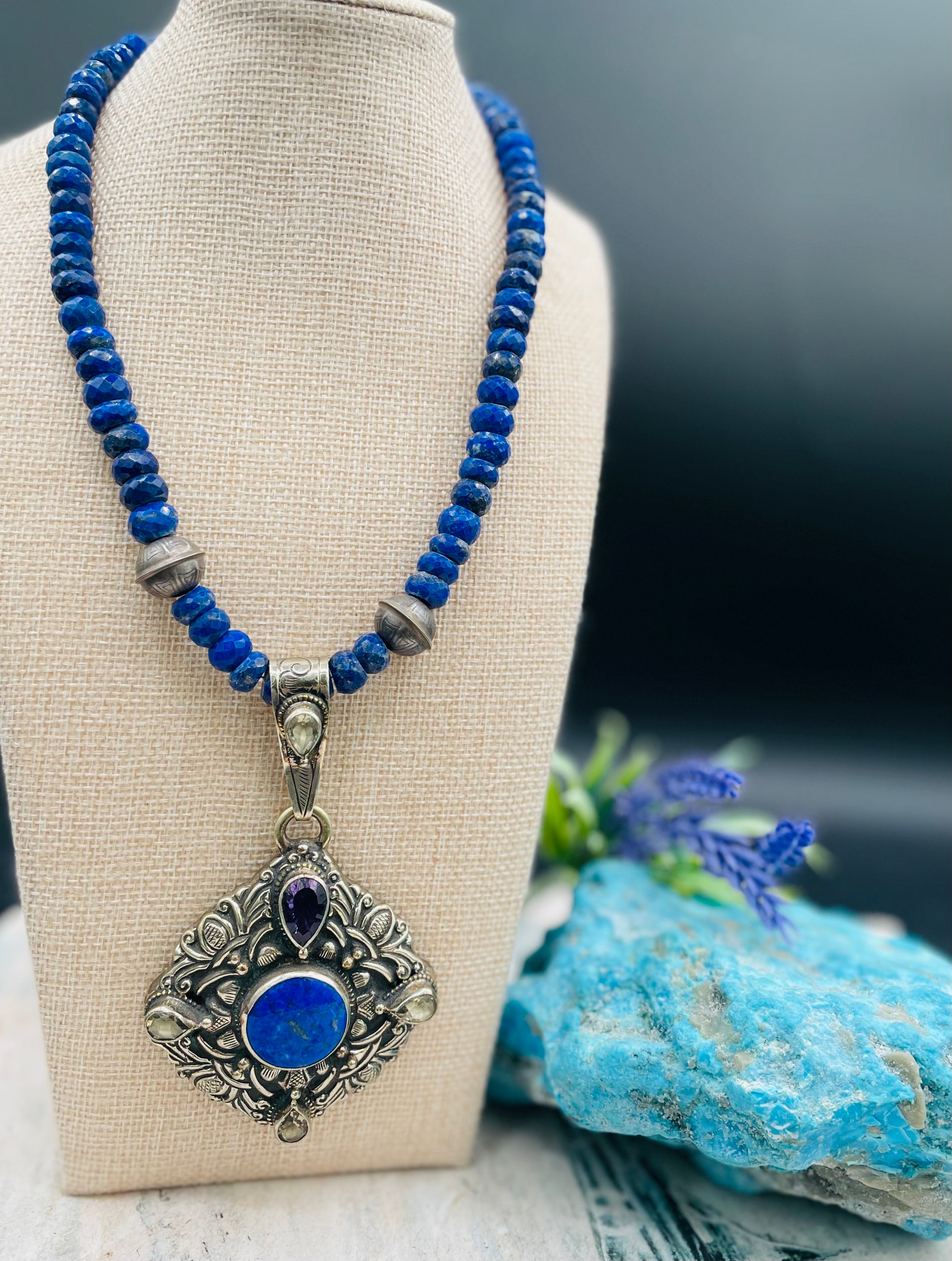 Lapis necklace with stamped sterling silver beads and a Bali silver pendent featuring lapis, lemon quartz, and amethyst. Available only from Rockstar Cowgirl online or in store in  
Cody, Wyoming.  