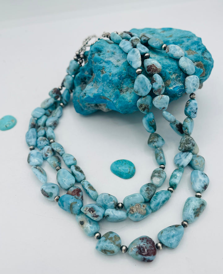 Beaded 3 strand necklace featuring smooth larimar nuggets and sterling silver beads. Available only from Rockstar Cowgirl online or in store in Cody, Wyoming.