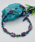 This necklace features Kingman turquoise, purple Mojave turquoise, Charoite, and sterling silver beads. Available only from Rockstar Cowgirl online or in store in Cody, Wyoming.
