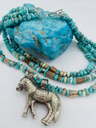 3 strand necklace featuring Campitos turquoise, chrysoprase, and deer antler beads with a donkey pendent. Available only from Rockstar Cowgirl online or in store in Cody, Wyoming.