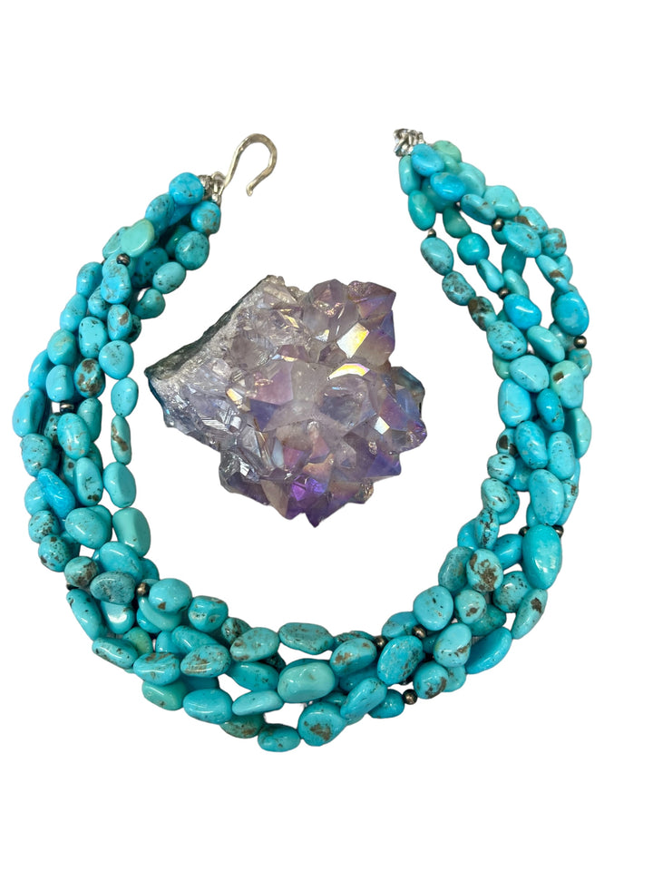 5 strand torsade or twisted necklace featuring Sonoran turquoise and sterling silver Navajo pearls with a hammered sterling silver hook clasp. Available only from Rockstar Cowgirl online or in store in Cody, Wyoming.