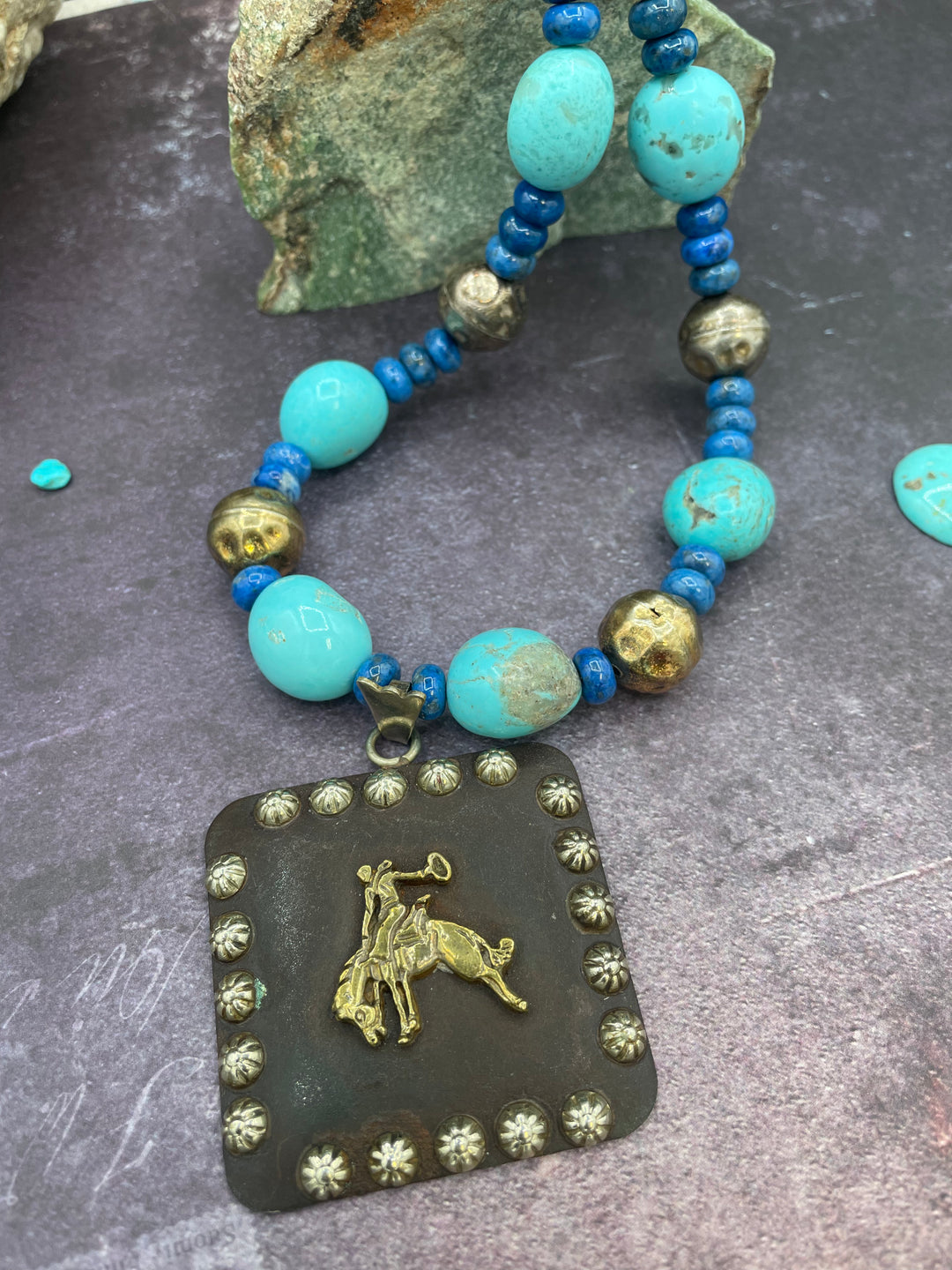 Close up of the large concho and the  center of the necklace. Highlighting the matrix in the Kingman turquoise and texture of the beads. Available only from Rockstar Cowgirl online or in store in Cody, Wyoming.