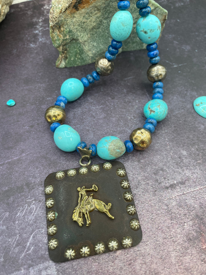 Close up of the large concho and the  center of the necklace. Highlighting the matrix in the Kingman turquoise and texture of the beads. Available only from Rockstar Cowgirl online or in store in Cody, Wyoming.