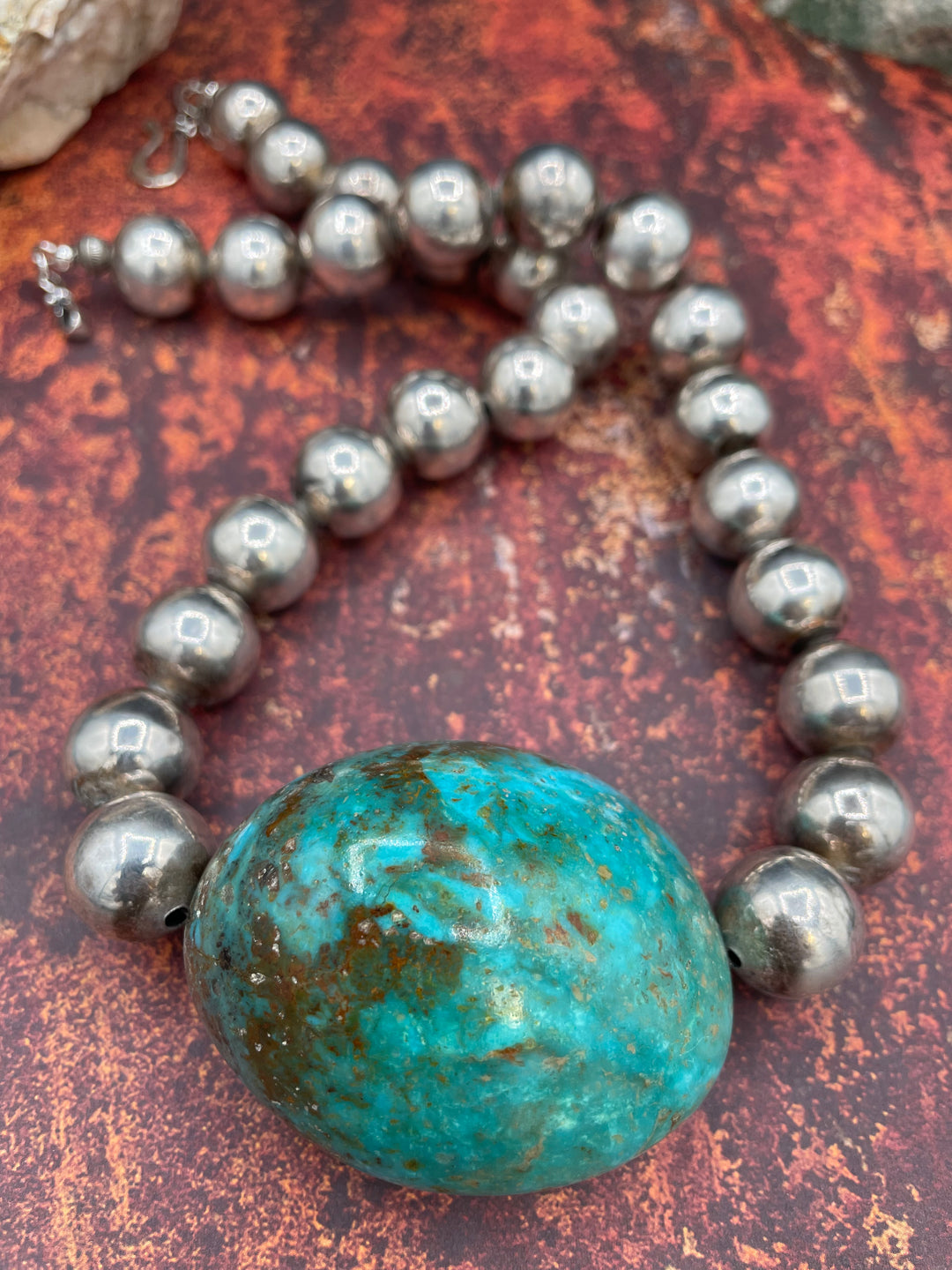Close up of the unique copper and golden matrix in this giant Kingman Turquoise nugget and sterling silver necklace available only from Rockstar Cowgirl online or in store in Cody, Wy.