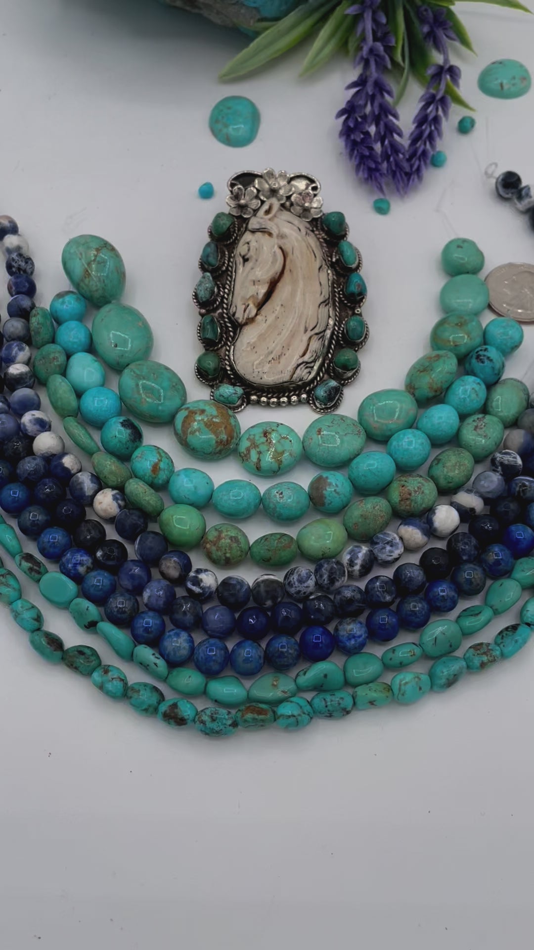 Bead box featuring Kingman turquoise nuggets in 3 colors, sodalite calcite, sodalite, denim lapis, Hubei turquoise, and carved bone horse and turquoise pendent. U.S. quarter for size reference. Available only from Rockstar Cowgirl online or in store in Cody, Wyoming.