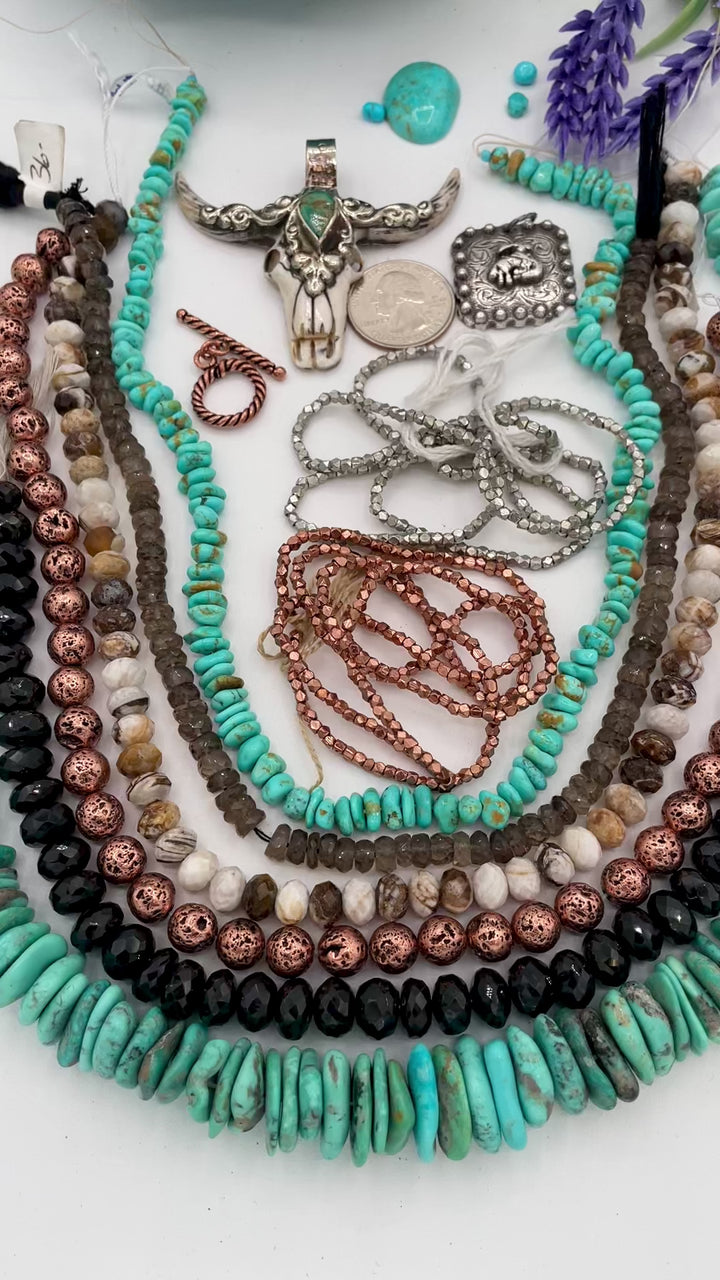 Bead box featuring Campitios and Sonoran turquoise, Australian chrysoprase, spinel, smokey quartz, copper plated lava, with a bone steer pendent. U.S. quarter for size reference. Available only from Rockstar Cowgirl online or in store in Cody, Wyoming.